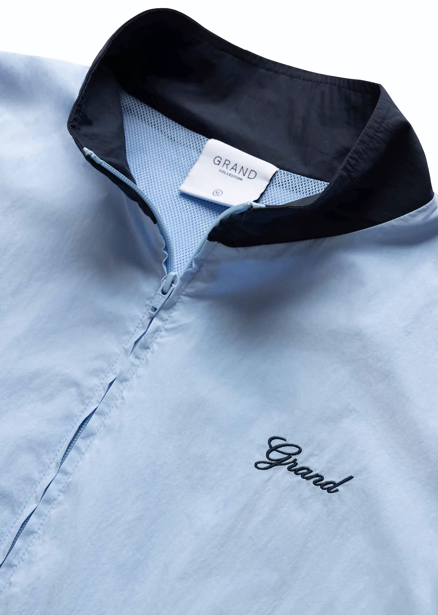 GRAND COLLECTION COTTON/NYLON TRACK JACKET 'POWDER BLUE/NAVY'